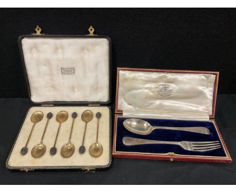 A cased set of six silver gilt coffee bean spoons, with shell shaped bowls, William Suckling Ltd, Birmingham 1937;  cased for