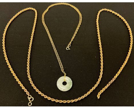 A 9ct gold rope twist necklace, 9.5g;  a green stone jade ? ring pendant necklace, unmarked yellow metal chain necklace, 56cm