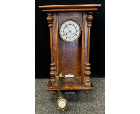 An walnut cased Vienna wall clock, white enamel face, roman numerals, early 20th century, 70cm high.