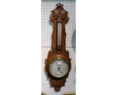 An Edwardian oak cased barometer and thermometer by Dolland of London, 92cm high