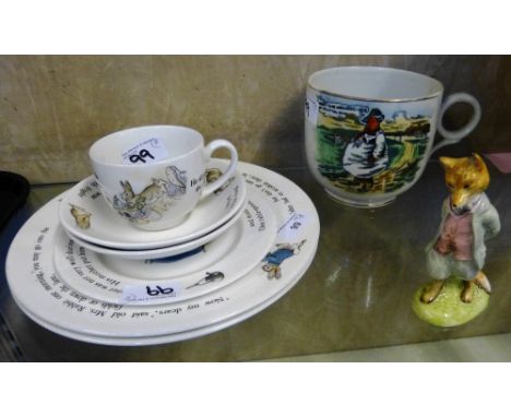 Wedgwood Peter Rabbit dinner service, comprised of one cup, two saucers, three plates together with a large mug and a figurin