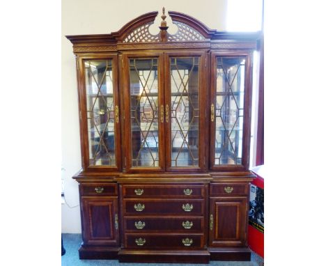 A mahogany Chippendale style breakfront cabinet, by Universal Kensington Square Range, with mirror-backed/illuminated display