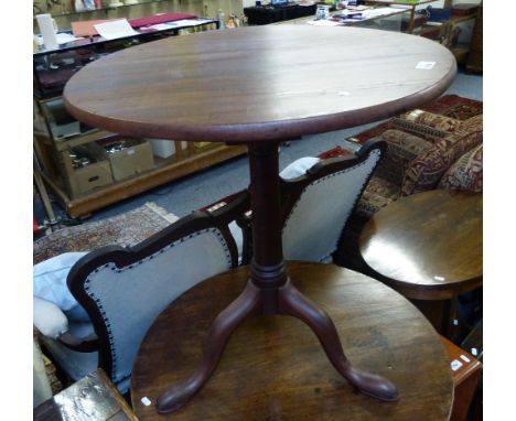 A Georgian mahogany circular tilt-top tripod table, with bird cage support, 62cm diameter