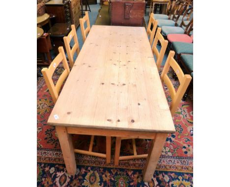 Stripped pine farmhouse style kitchen table, 182cm long, and a set of six beech ladder-back chairs (7)