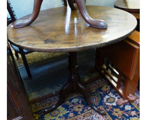 A Georgian mahogany circular tilt-top tripod table, 76cm diameter