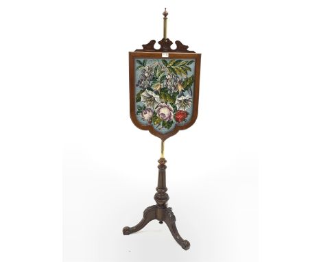  Victorian walnut pole screen broken arch pediment over a bead and needle work tapestry panel of shield form, turned baluster