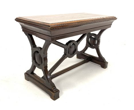  Early 20th century Arts and Crafts style oak and stained pine communion table, with carved panel end supports united by stre