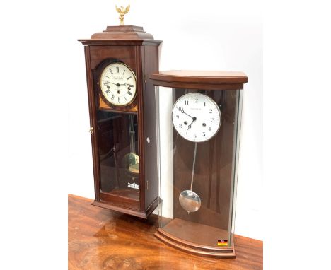  Modern glass and walnut cased wall clock by Hermle, white enamel dial with Arabic chapter ring, twin spring driven movement 