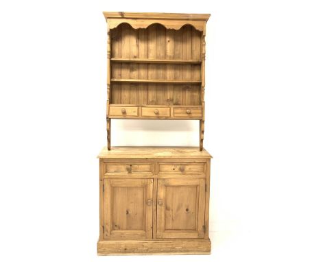  Solid pine two drawer dresser, wall hanging three height plate rack with three spice drawers, two drawers and two cupboards 