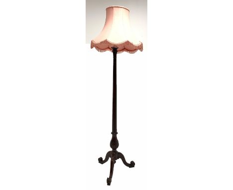  Quality mahogany 1920's standard lamp, with leaf carved and fluted column raised on triple spay supports, with tasseled shad