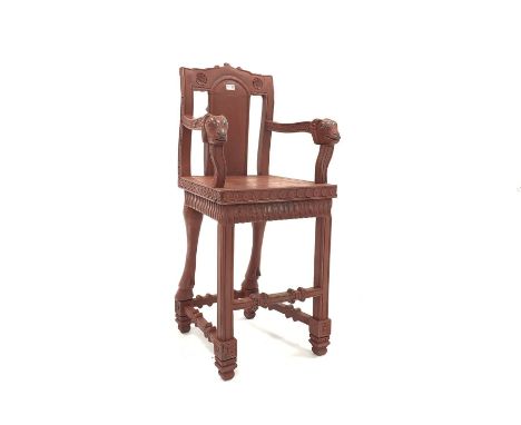  20th century Indo-Persian design carved and painted hardwood high chair, ram head arm terminals, panel seat, floral caved fr