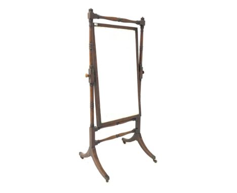  Mahogany Cheval mirror circa 1820, with ring turned supports and stretchers raised on splayed base with brass cup castors, 8