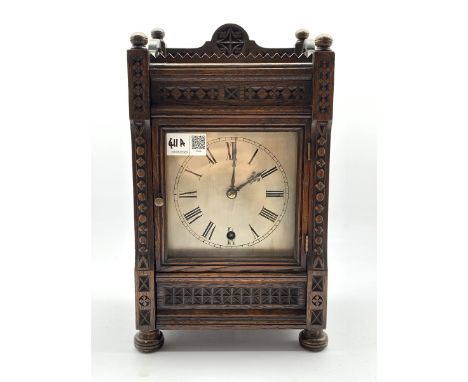  Late Victorian carved oak cased mantel timepiece, silvered dial with Roman numeral chapter ring, eight day single train driv