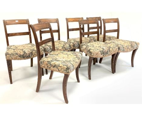  Set seven Georgian mahogany dining chairs with bar backs and reeded decoration over upholstered seat panel, raised on sabre 