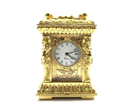  20th century miniature ornate brass carriage time piece, white enamel dial with Roman numeral chapter ring, signed 'Frigona'