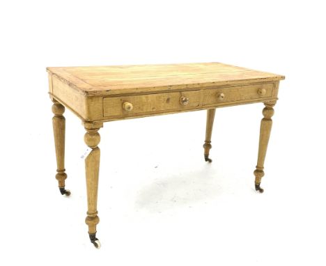  Victorian scumbled pine kitchen table, with two frieze drawers raised on turned supports and ceramic castors, W119cm x 59cm,