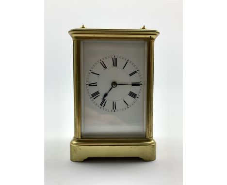  Early 20th century brass four glass carriage time piece, white enamel dial with Roman numeral chapter ring,  movement stampe