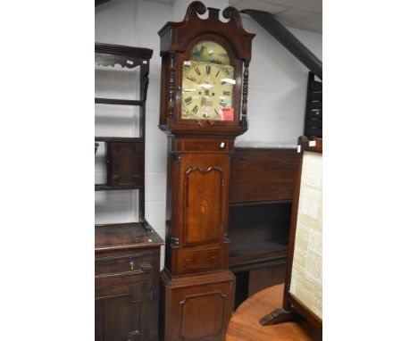A 19th century oak and mahogany eight day long case clock, by John Cotterill, Wirksworth, having a swan neck pediment over th