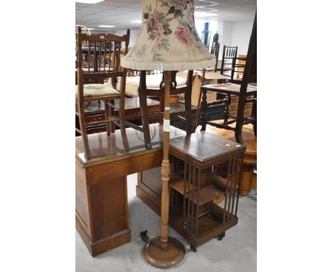 A late 20th century tuned wooden standard lamp, with fluted detail and floral shade 151cm to fitting