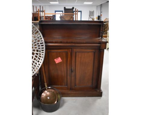 A 19th century mahogany chiffonier, of traditional design with inverted break-front top, cushion moulded frieze drawer and tu