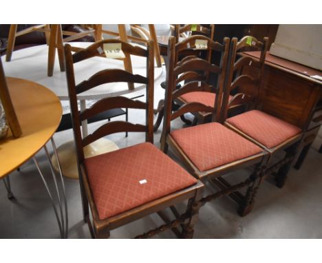 A set of four 20th century oak ladder back dining chairs, with arched rails and turned supports, seat height 48cm