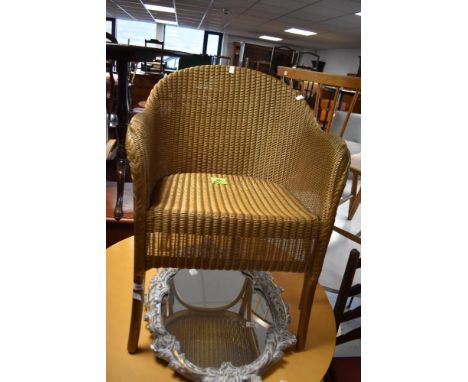 A vintage Lloyd Loom Lusty gilt painted woven wicker armchair 42cm seat height