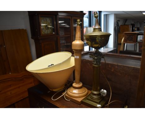 An impressive brass Corinthian column table lamp, converted to electic with cable and fitting, sold along with a modern turne