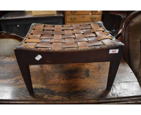 Arthur W Simpson, The handicrafts, Kendal An Arts and Crafts oak stool, the typical concaved seat with interlaced leather str