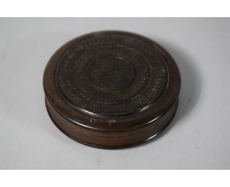 A Circular Wooden Snuff Box with Concentric and Interlocking Ring Decoration, 7.5cms Diameter 