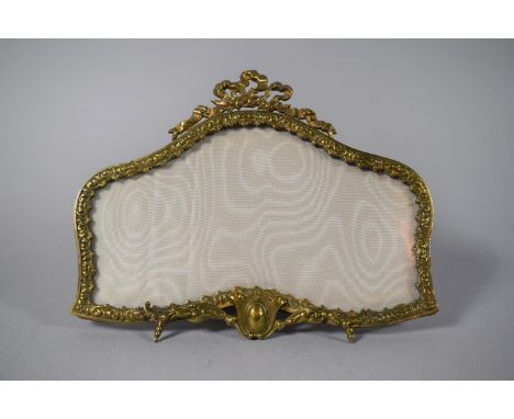 A French Ormolu Shaped Easel Back Photo Frame with Ribbon Finial, 22cms Wide 