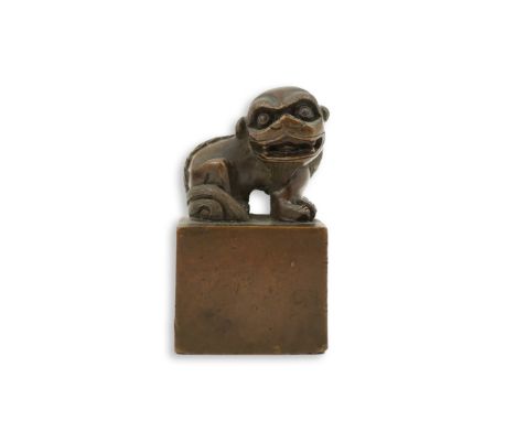 A Chinese bronze 'lion-dog' seal, 19th century, seated on square base with seal mark, 5.5cm tall Some small dents to the corn