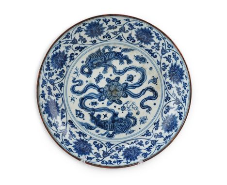A Chinese blue and white 'Buddhist lions' dish, Ming Dynasty or later, painted with Buddhist lions surrounding a ribbon tied 