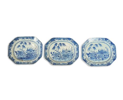 A set of three Chinese blue and white meat dishes, Qianlong period, each painted with scholarly objects on a rockwork stand, 