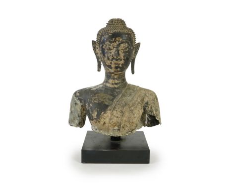 A large Thai lacquered bronze bust of Buddha, 17th/18th century, with serene expression, the robes cast in low relief with br