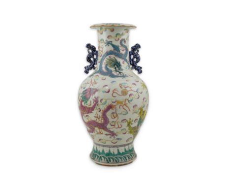 A Chinese enamelled porcelain ‘dragon’ vase, 19th century, painted with five different coloured five claw dragons, chasing fl
