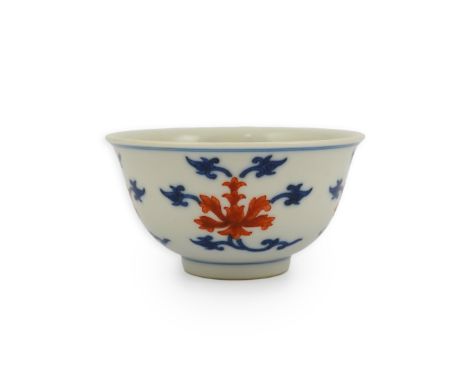 A Chinese underglaze blue and iron red bowl, Daoguang seal mark and possibly of the period, painted around the exterior with 