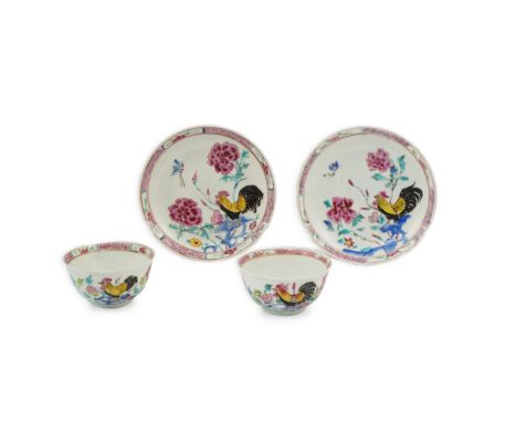A near pair of Chinese famille rose ‘cockerel’ tea bowls and saucers, Yongzheng period, each painted with a cockerel amid roc