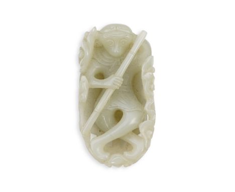A Chinese pale celadon jade carving of Sun Wukong, the Monkey King, 18th/19th century, the figure lying recumbent on a giant 