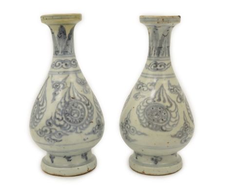 A pair of Chinese blue and white pear-shaped shipwreck vases, Ming dynasty, 15th century, each painted with flaming Buddhist 