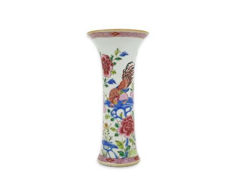 A Chinese famille rose ‘cockerel’ beaker vase, Qianlong period, painted with two cockerels amid rockwork and peonies, diaper 