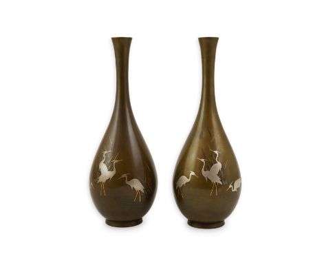 A pair of Japanese bronze and mixed metal inlaid bottle vases, signed Hidemitsu, Meiji period, each decorated with egrets wad