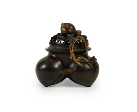 A large Chinese bronze and parcel gilt ‘peach’ censer and cover, Li, 17th/18th century cast in the form of three peaches with