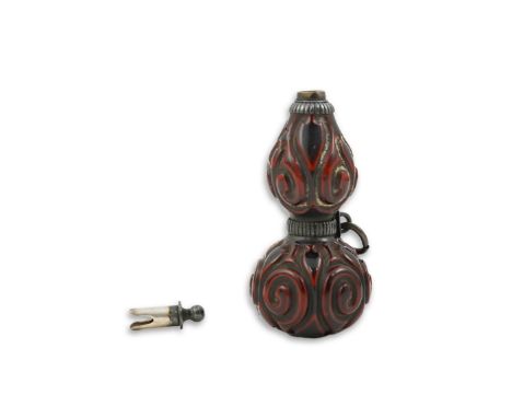 A Japanese guribori lacquer double gourd shaped netsuke, Edo period, late 18th/early 19th century, girded by a silvered metal