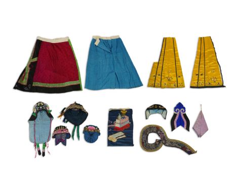 Two Chinese embroidered silk wedding skirts, late Qing, five hats, trousers, two skirt panels and two others, collar and a pa