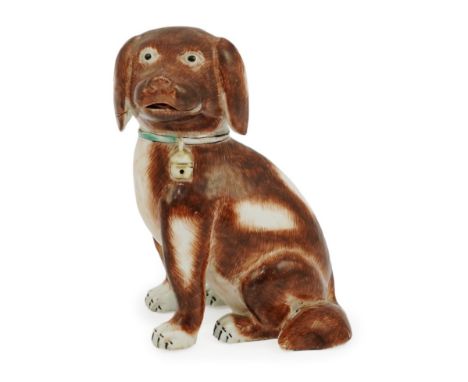 A Chinese export enamelled porcelain model of a seated spaniel, Qianlong period, wearing a collar with bell around its neck, 