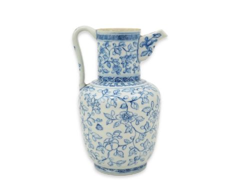 A Chinese blue and white ewer, Hongzhi mark, probably Qing dynasty, painted in pencil style with scrolling tendrils and flowe