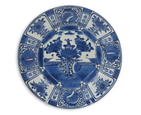 A good Japanese Arita blue and white dish, Genroku period (1688-1704), painted in kraak style with a central basket of flower