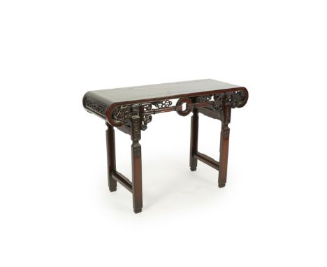 A small Chinese hongmu altar table, late 19th/early 20th century, the panelled top with pierced ruyi head scroll ends, the fr