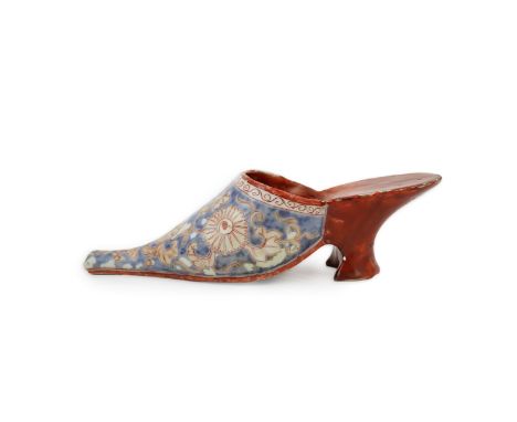 A rare Japanese Arita or Chinese porcelain model of a shoe, based on a Delft shape, first half of 18th century, decorated in 
