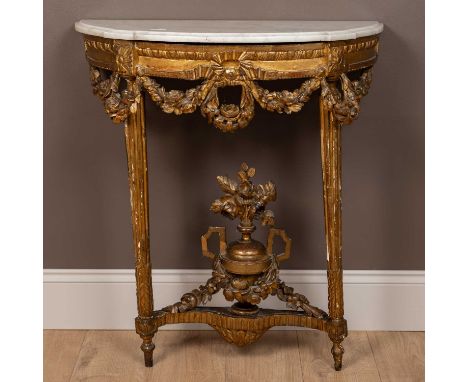 An 18th or early 19th century Continental gilt marble-topped console table, the shaped marble top conforming to the half-roun